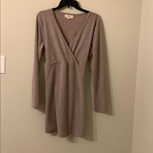 Long sleeved sweater dress.Deep V cut & never worn